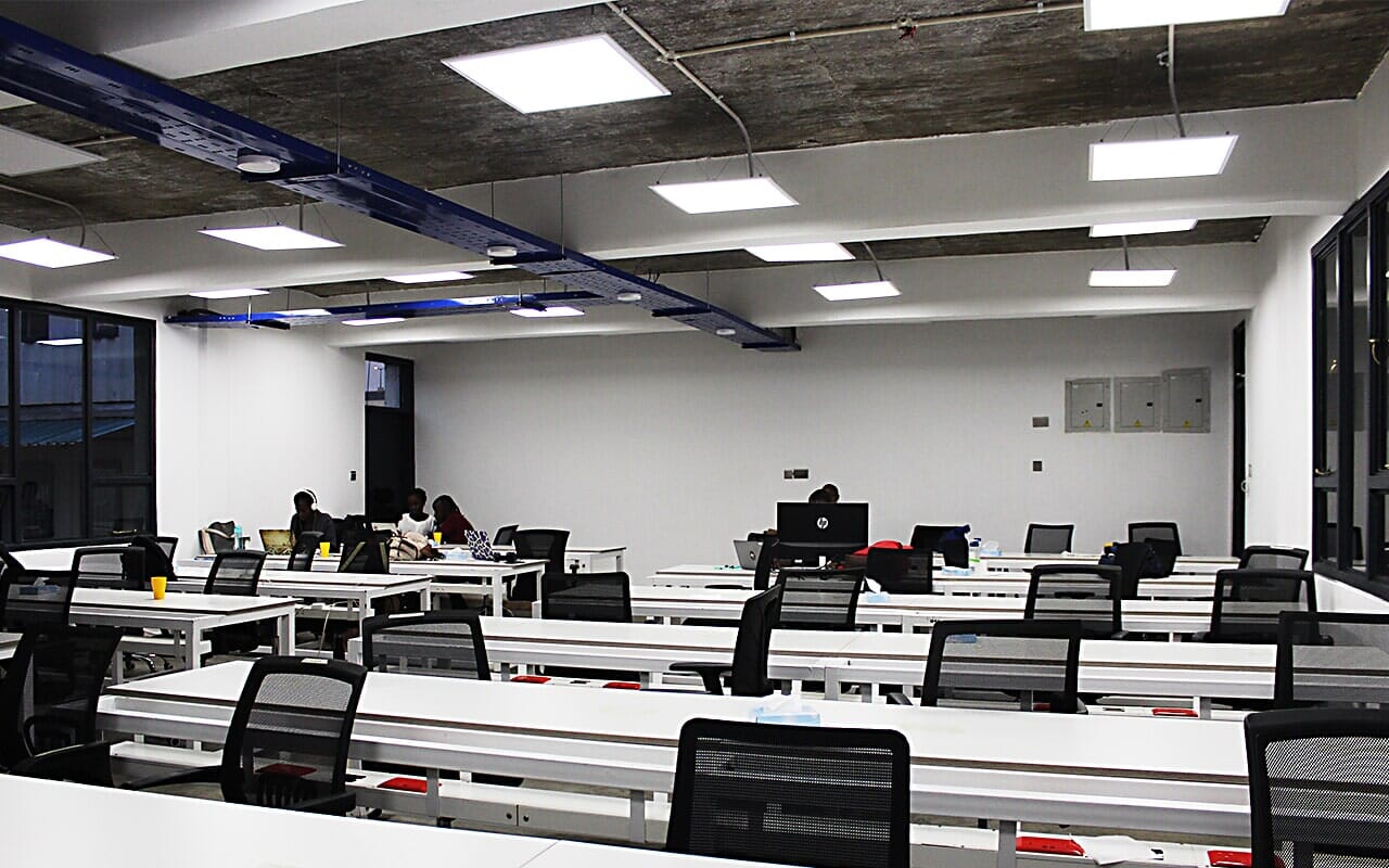 Office workstations beneath ceiling lights